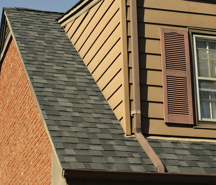 After house with cleaner brick and roofing